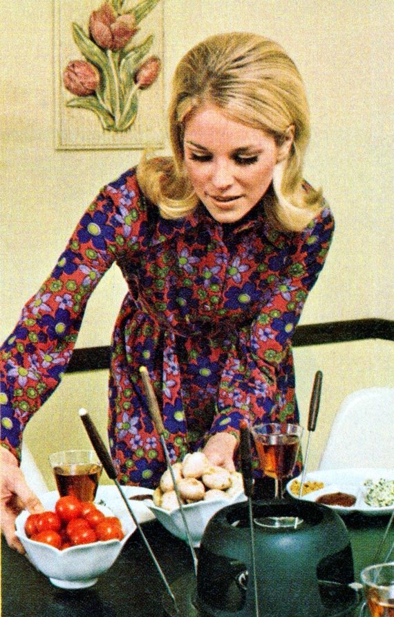 a woman is preparing food on a table