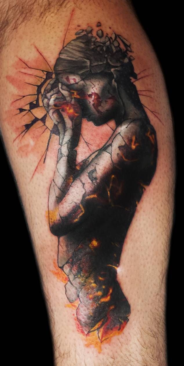 a man's arm with a tattoo on it that has an image of a woman holding