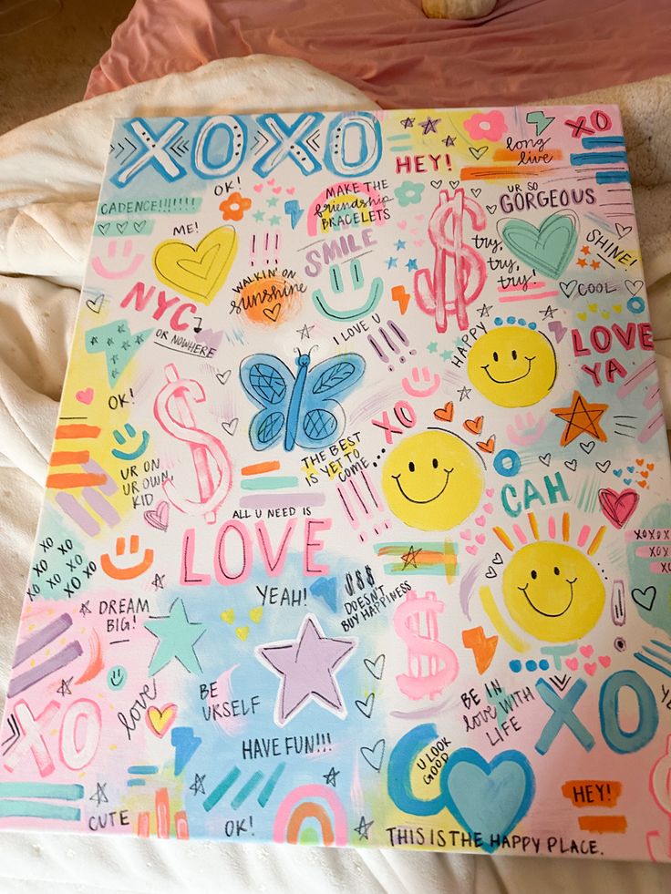 an image of a colorful painting on a bed with the words xoxo written all over it