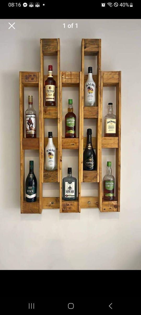 a wooden shelf with liquor bottles on it