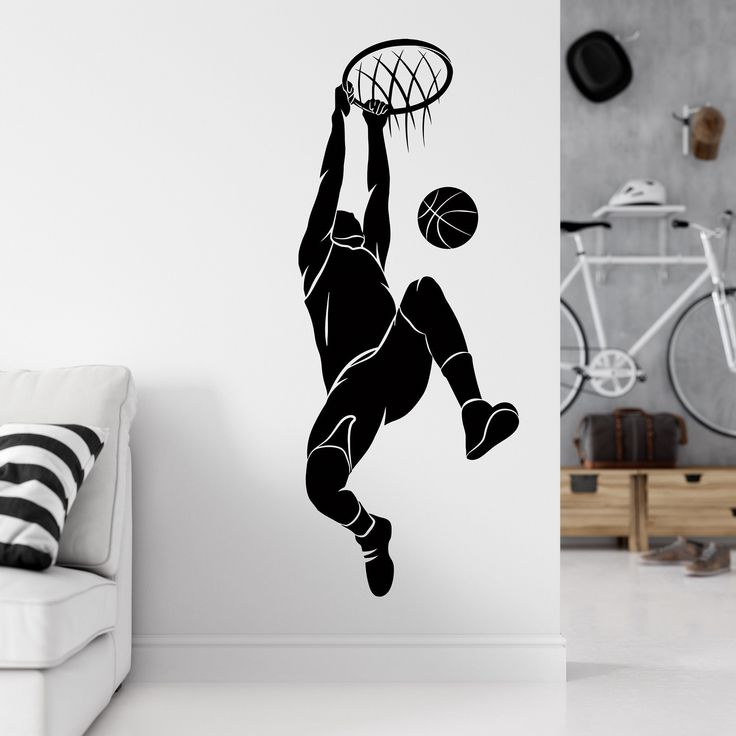 a basketball player dunking the ball into the hoop wall decal in a living room