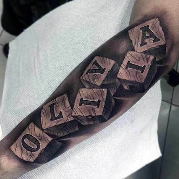 a man's arm with the word love written on it and blocks in black ink