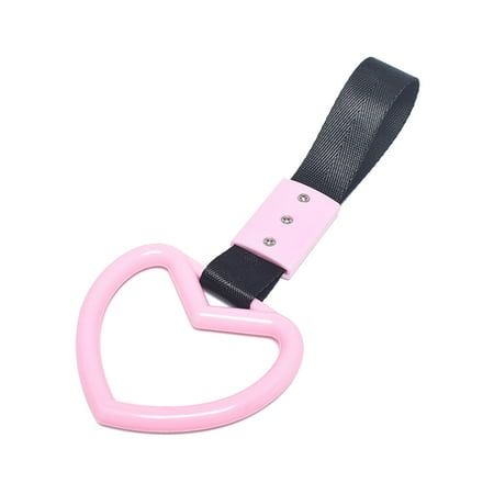 a pink and black heart shaped object on a white background