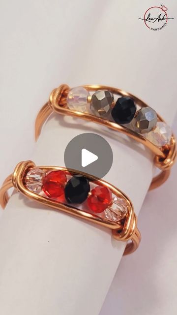 two rings with different colored stones on them