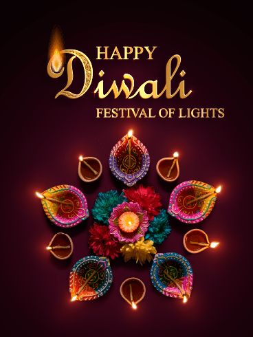 happy diwali festival of lights with colorful flowers and candles in the middle on dark background