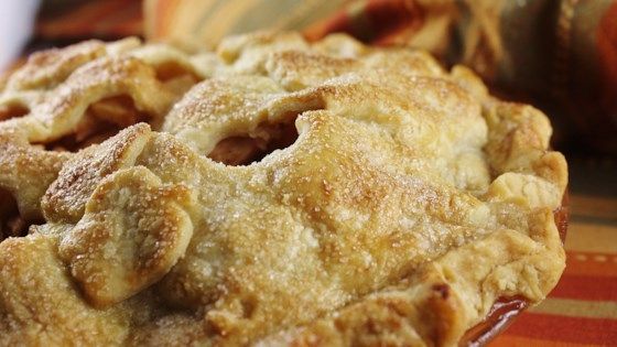 an apple pie sitting on top of a table