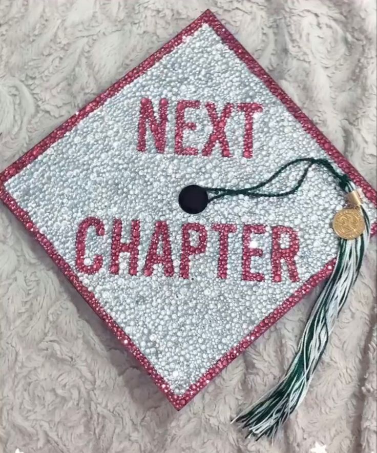 pink and Silver graduation cap completely rhinestones. Says “Next Chapter” Graduation Cap Designs Class Of 2023, Graduation Cap Designs 23, Grad Cap Ideas Middle School, Cap Decoration Graduation Rhinestones, Pink Rhinestone Grad Cap, Graudtion Caps Ideas 2023, Cute Girly Graduation Cap, Beauty School Cap Ideas, Middle School Cap Decoration