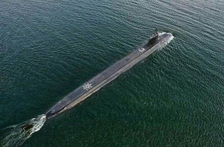 an aerial view of a submarine in the water