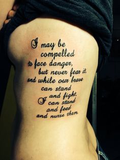 a woman with a tattoo on her back saying i may be completed to face danger, but never fear it and unable to stand