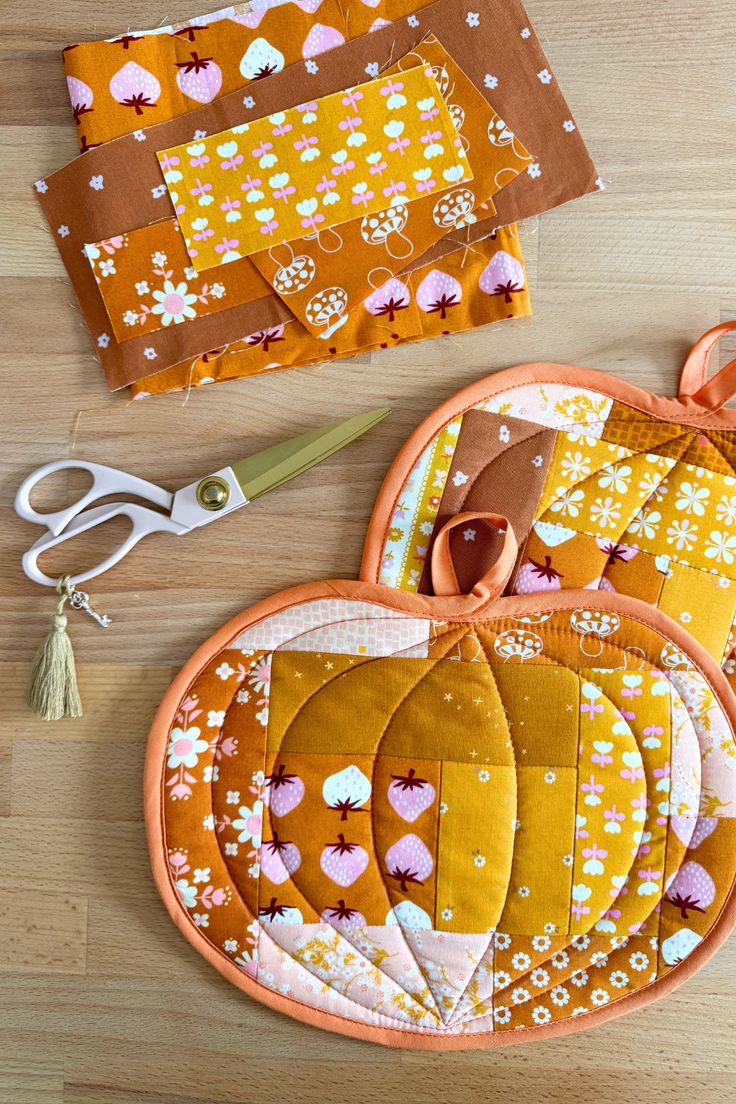 sewing supplies laid out on top of a wooden table