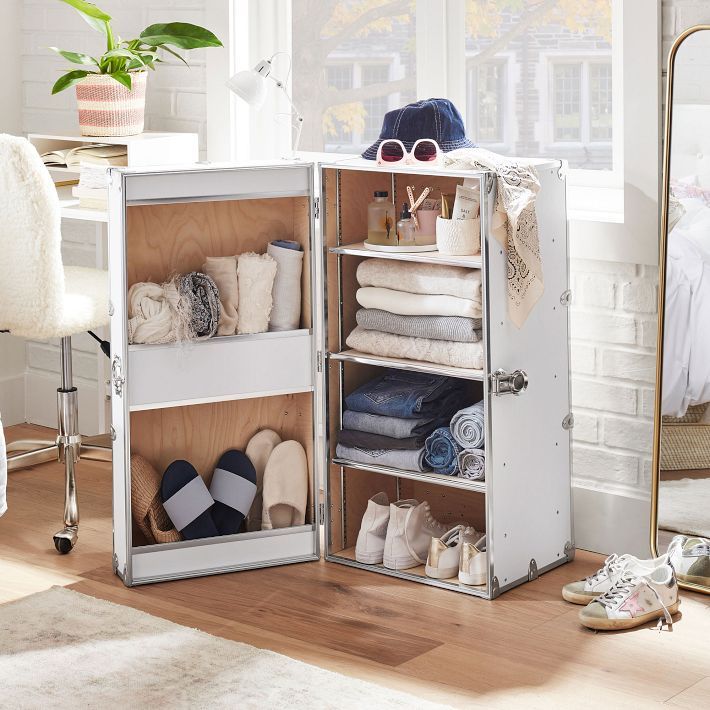 an open cabinet filled with lots of shoes