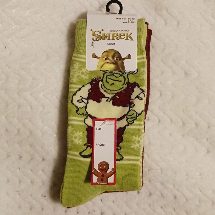 a pair of socks with an image of shrapk on the front and bottom