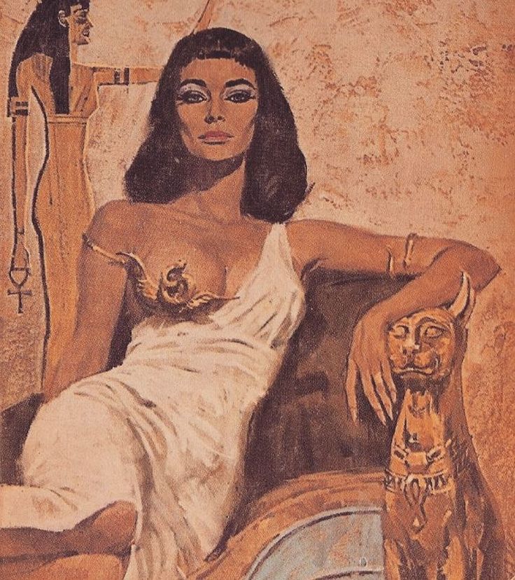 an egyptian woman sitting on a couch with her arm resting on the back of a chair