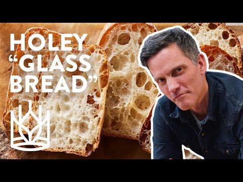 a man sitting in front of slices of bread with the words holey glass bread on it