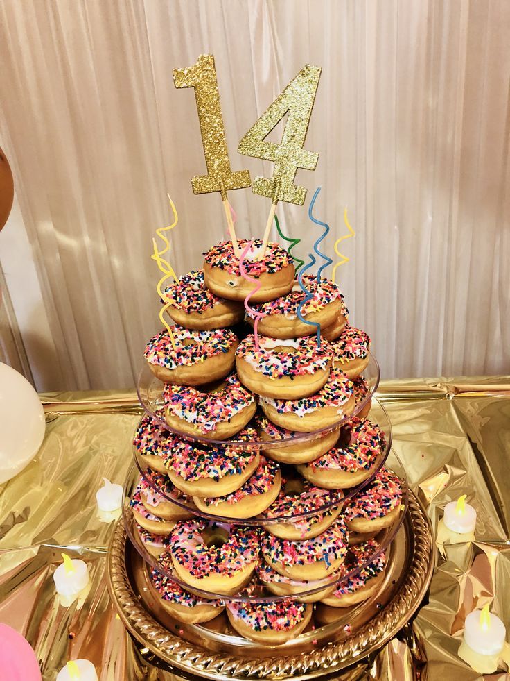 a cake made out of donuts with sprinkles