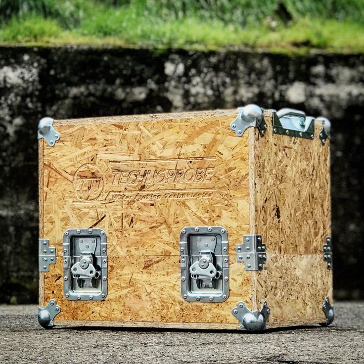 an old wooden box sitting on the ground