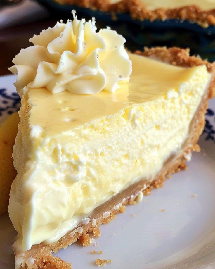 a slice of cheesecake with whipped cream on top