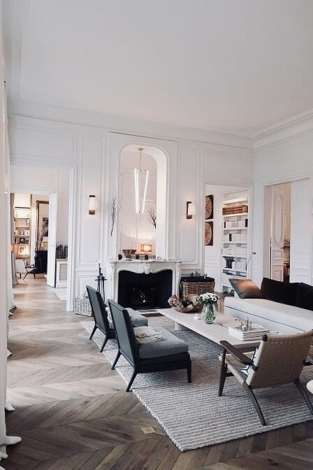 a living room filled with furniture and white walls