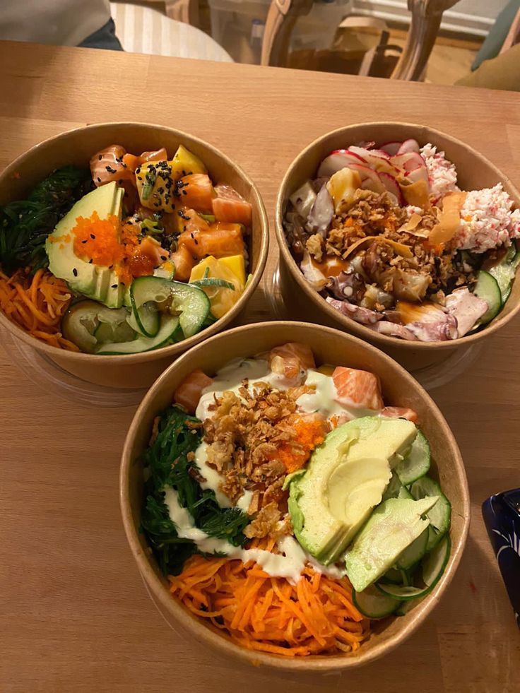 three bowls filled with different types of food