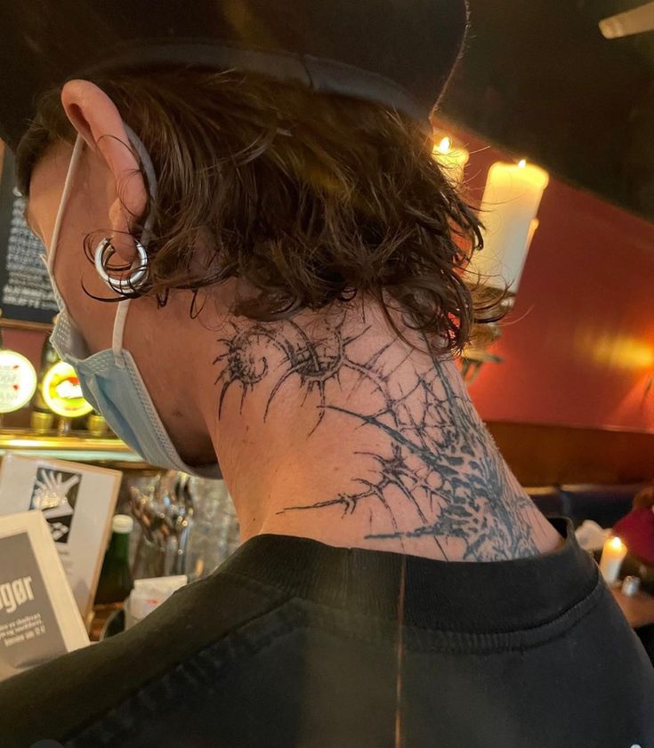 a person with a tattoo on their neck