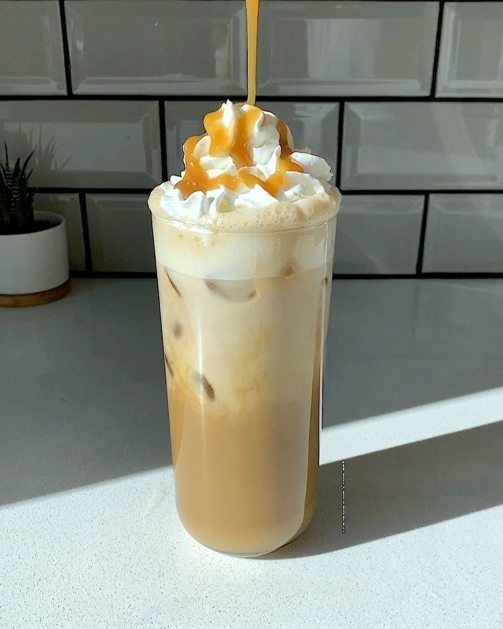 there is a drink with whipped cream and caramel on top