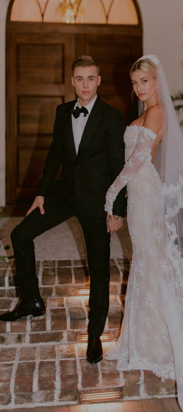 a bride and groom posing for a photo