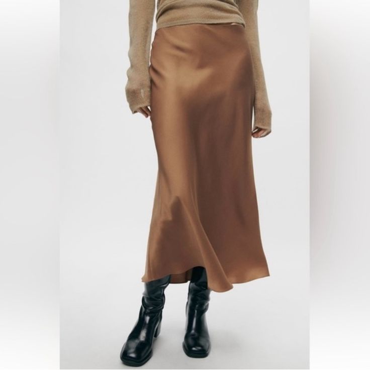 Zara Satin Effect Midi Skirt. Beautiful Brown Satin Midi Skirt With Zipper Closure. Great Quality, Nice Weight To The Fabric. Condition: Nwt, I Have A Similar Item That I Wear Instead Color: Warm-Toned Brown Size: S Elegant Brown Asymmetrical Skirt, Elegant Brown Midi Skirt, Elegant Brown Midi-length Skirt, Elegant Brown Midi Length Skirt, Elegant Zara Midi Skirt, Zara Flowy Midi Skirt, Zara Pleated Skirt For Fall, Zara Long Pleated Skirt, Zara Flowy Skirt For Work