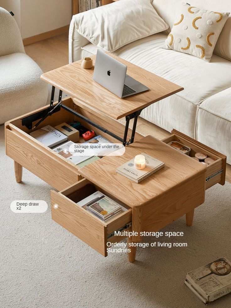 a coffee table with an open drawer underneath it and a laptop on the top shelf