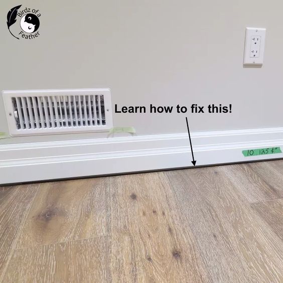 an air conditioner sitting on top of a wooden floor next to a wall with the words learn how to fix this