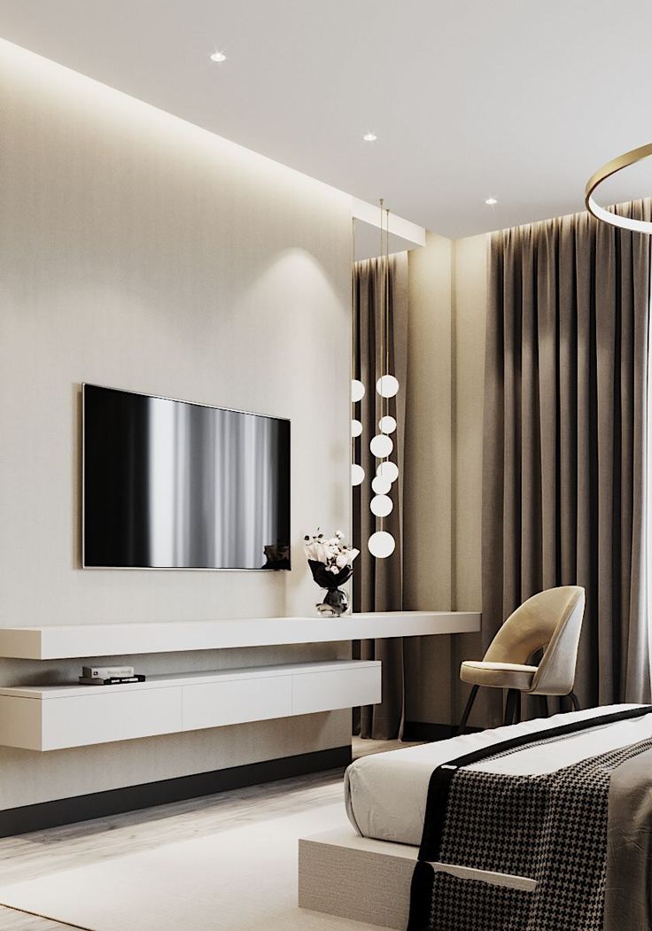 a living room with a large flat screen tv mounted on the side of it's wall