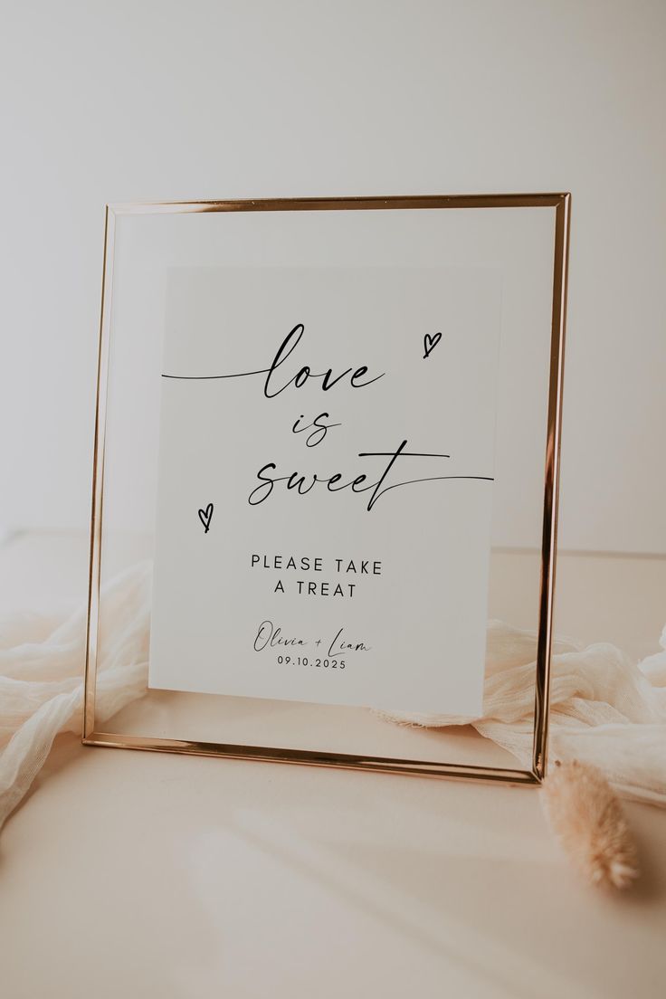 a sign that says love is sweet on the side of a white and gold frame