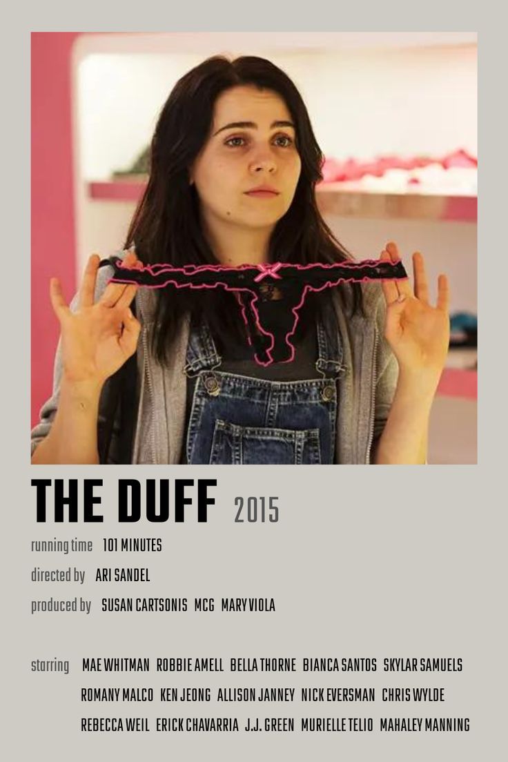 a woman is holding up her hair in front of her face and the words, the duff 2013