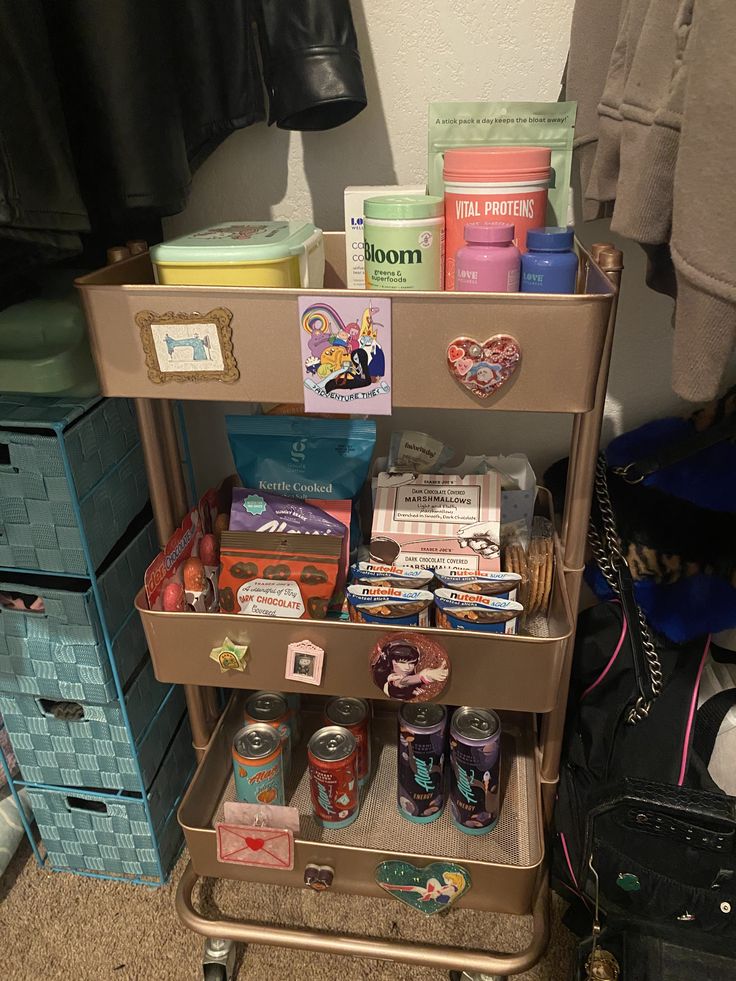 a cart filled with lots of items on top of a carpeted floor