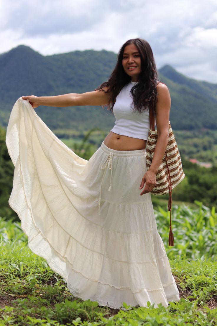 All items are shipped Thailand Post. Free upgrade when you buy 2 items or more.The USA only. Please leave a phone number with orders . From Twist and Crinkle Collection Similar skirt to my smock elastic waist skirts .For those people who prefer the smaller waist band The color is natural cotton which is an off white color . This lovely Boho piece is made from 100% cotton . Its half lined with an elastic waist band. and ties The skirt is in 5 tiers. A great piece to wear with a tight or cropped t Low Waisted Maxi Skirt Outfit, Beige Tiered Mini Skirt For Beach, Beige Festival Skirt, Festival Beige Tiered Skirt, Beige Bohemian Mini Skirt, Bohemian Beige Mini Skirt, Beige Tiered Maxi Skirt For The Beach, Beige Ruffled Skirt For Beach, Beige Cotton Beach Skirt