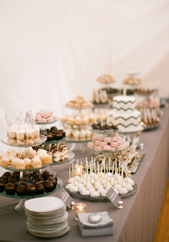 a long table topped with lots of desserts