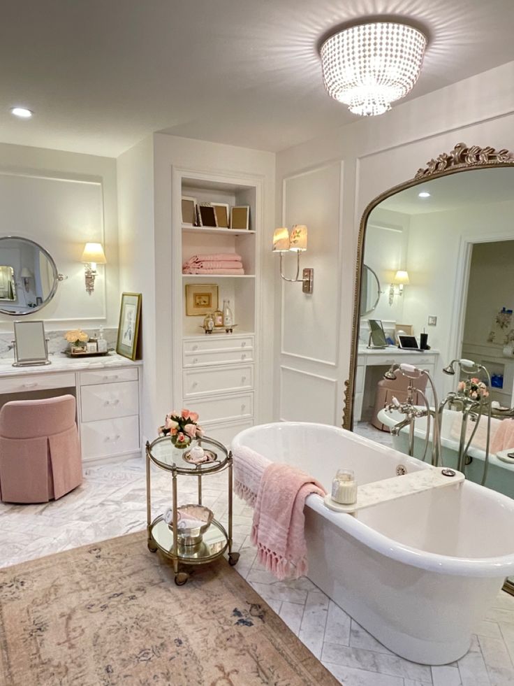 a bathroom with a claw foot tub and vanity