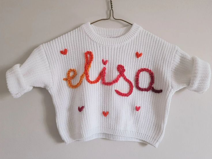 This Gender-Neutral Kids Sweaters item is sold by BestBabyNestShop. Ships from Canada. Listed on Sep 29, 2023 Baby Name Sweater, Knit Baby Sweater, Name Sweater, White Violet, Knit Baby Sweaters, Baby Nest, Star Pillows, Cute Pillows, Baby Name