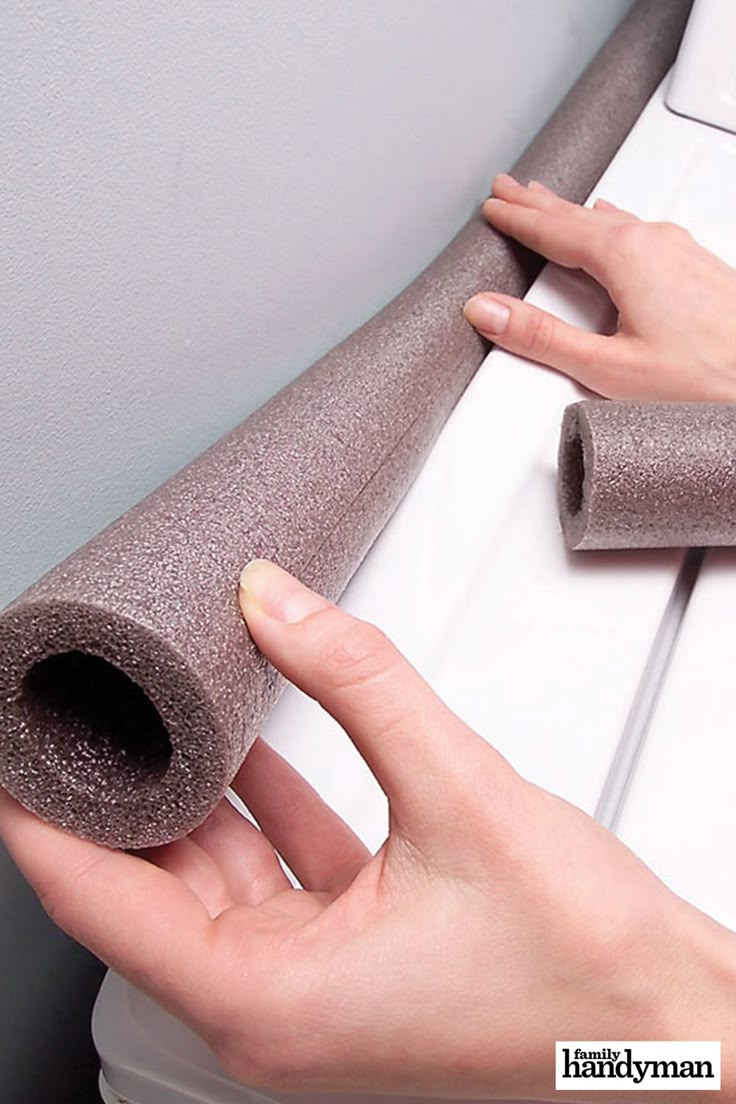 a person holding onto a roll of glittered paper