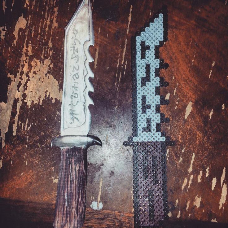 an old knife and a new one sitting on a table