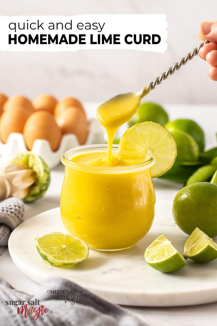 a person is squeezing lime into a small glass jar with a spoon and some eggs in the background