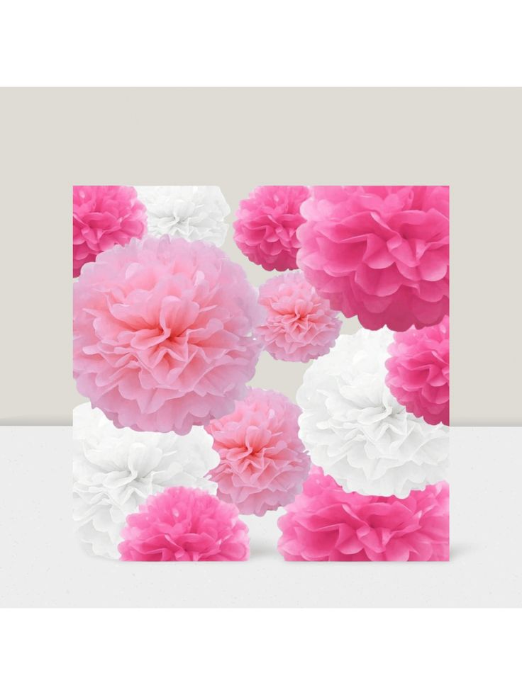 pink and white pom - poms are arranged in the shape of a square