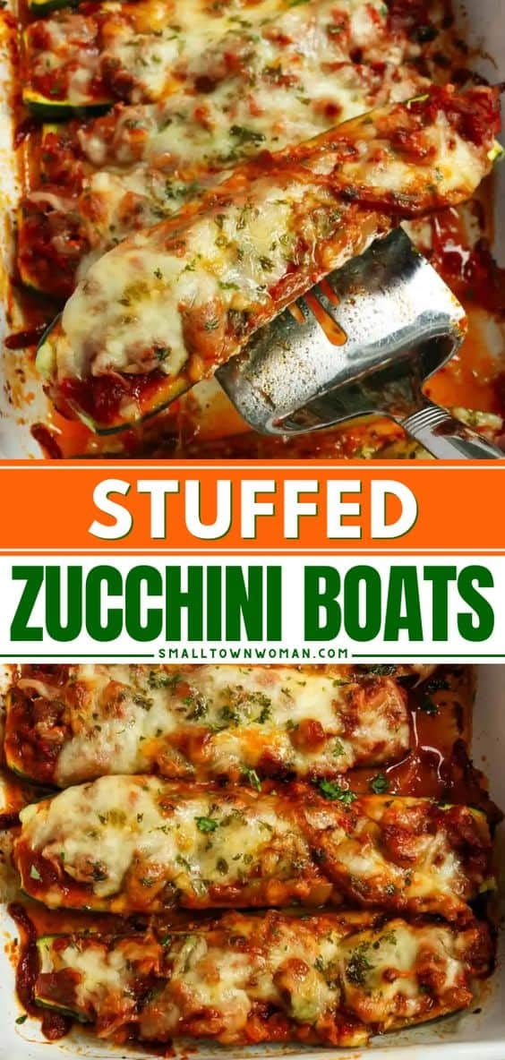 stuffed zucchini boats in a white casserole dish with a spatula