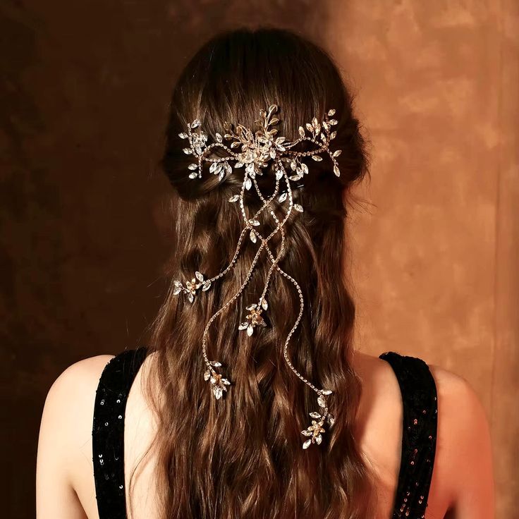 Romantic and elegant, this unique bridal hair comb with cascading vines is the perfect accessory for your special day. Adorned with intricately faceted rhinestones that capture the light from every angle with a perfectly translucent appeal, it gives your hair an extra touch of glam to finish off your perfect look on your perfect day. Cast in lightweight alloy and rhodium / gold plated for a flawless finish, the comb measures 7.5" (approx. 19cm) across and 15" (approx. 38cm) long. The small comb on the back make it easy to attach to your hair and keep it sturdily in place. The vines with crystals are flexible and can be molded based on your preferences to suit your hair style. Available in Silver and Yellow Gold finishes. To make your choice select your preferred finish from the dropdown me Unique Bridal Hair, Vine Hair Piece, Sky Outfit, Comb Hair, Bridal Hair Comb, Hair Vine, Perfect Day, Hair Piece, Wedding Hair Accessories