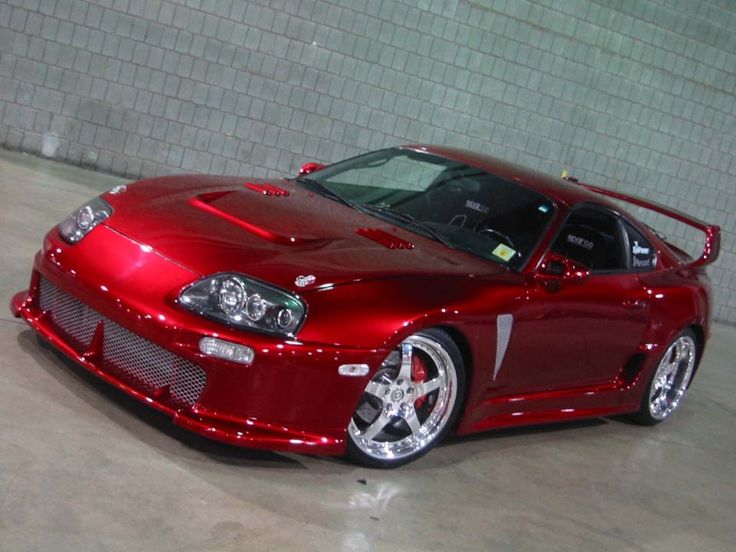 a red sports car parked in a garage