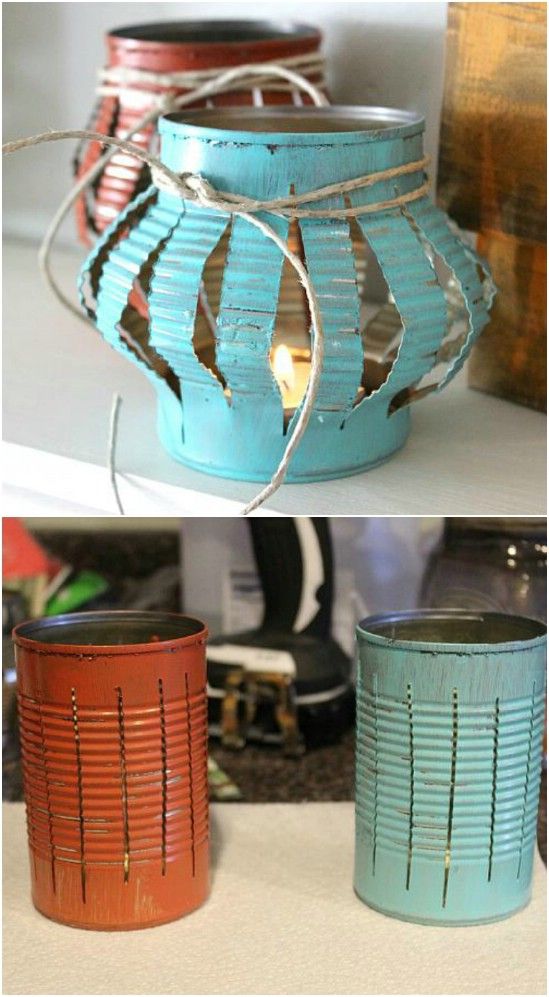 three different colored tin canisters sitting on top of a table next to each other