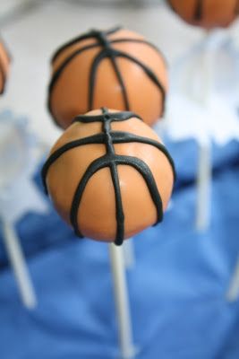 basketball cake pops with chocolate frosting on top