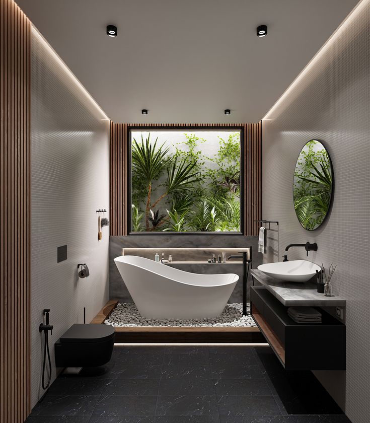 a modern bathroom with two sinks and a large bathtub in the center, surrounded by greenery