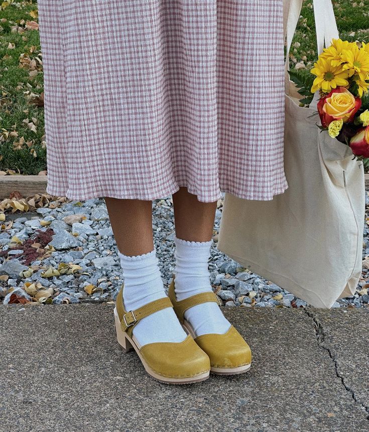 Step up your style game with Victoria, the classic clog sandal that's a bestseller for a reason. With its timeless design and unbeatable comfort, you'll strut confidently through any occasion in these high-heel stunners. Clog measurements:Heel height: 2 5/8” (6.5 cm)Toe height: 1 1/2” (3.8 cm)Fit:NarrowLeather:Nubuck leatherClogs consist of:Base: European Lime WoodSole: Rubber soleFastening: StaplesOther: Metallic buckle Shoes To Wear With Dresses, Sandgrens Clogs, Victoria Style, Leather Types, Royal Yellow, Clogs Outfit, Classic Sandals, High Heel Clogs, Cork Sandals