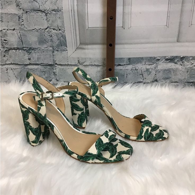 Gianni Bini Green Palm Frond And White Heeled Sandal Heel Height: 3” White Fabric Round Toe Sandals, Chic Floral Print Heels For Vacation, Party Sandals With Floral Print In Synthetic Material, White Casual Fabric Heels, Casual White Fabric Heels, Vacation Ankle Strap Fabric Heels, Floral Print Open Toe Sandals For Party, Floral Print High Heels For Vacation, Casual White Heels With Floral Print