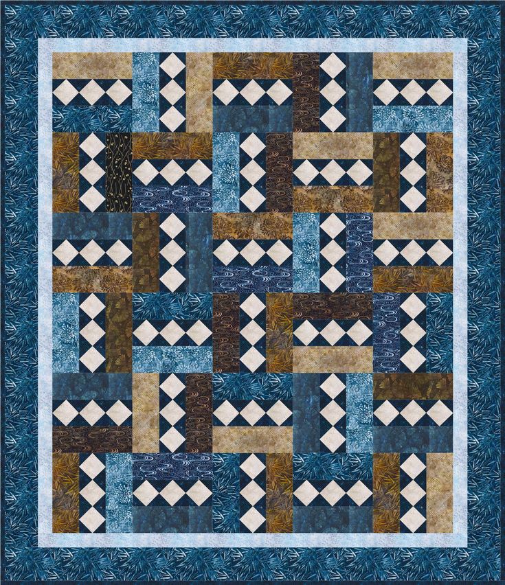 a blue and brown quilt with squares on the front, one block in the middle